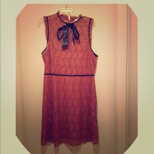 Lace dress with attached ribbon bow